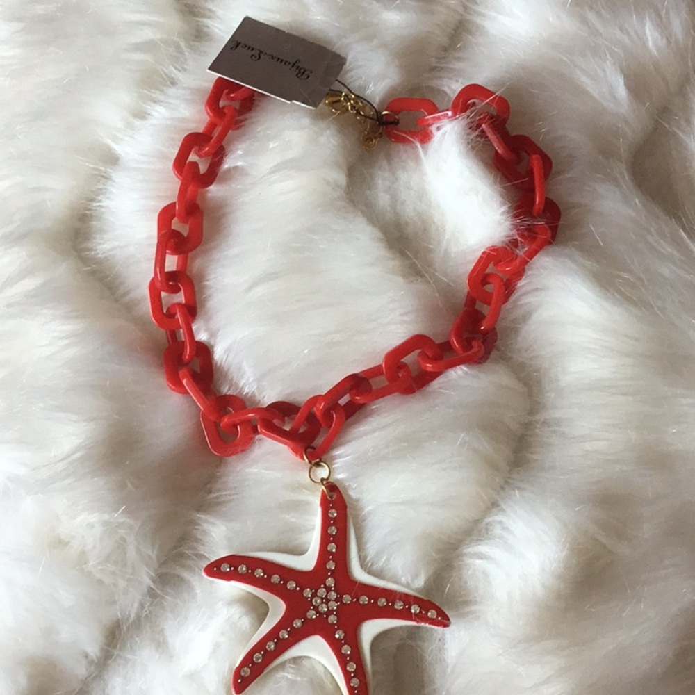 Short red starfish necklace.